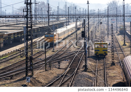 Complicated railway network with power lines and freight wagon for track maintenance, sunny day, high angle view, Smichov, Prague, Czech Republic 134496840