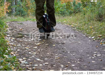 man rides down the trail on a monocycle. close up unicycle. 134497234