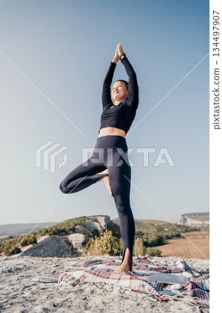Yoga Pose in Nature - Tree Pose on a Clifftop Yoga Pose in Nature - Tree Pose on a Clifftop 134497907