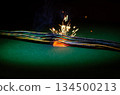 A close-up of overheated cables with sparks shows the risk of fire and electrical accident. 134500213