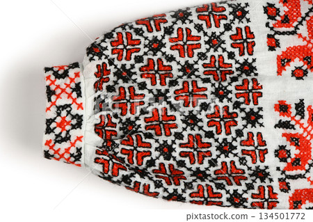 Detailed Red and Black Traditional Embroidered Sleeve Cuff on White Linen Detailed Red and Black Traditional Embroidered Sleeve Cuff on White Linen 134501772