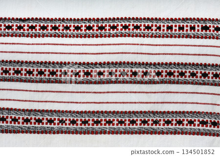 Traditional red and black geometric cross-stitch embroidery texture on white Traditional red and black geometric cross-stitch embroidery texture on white 134501852