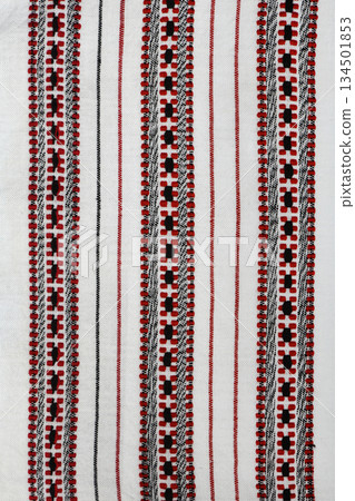 Traditional red and black geometric cross-stitch embroidery texture on white Traditional red and black geometric cross-stitch embroidery texture on white 134501853