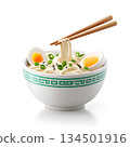 Delicious bowl of ramen noodles topped with soft-boiled eggs, green onions, and sesame seeds. Perfect for food lovers and culinary enthusiasts seeking a comfort meal. 134501916