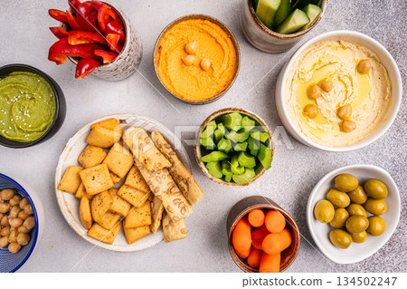 Various hummus dips, healthy and vegan snack Various hummus dips, healthy and vegan snack 134502247