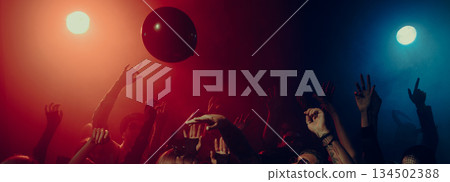 Colorful balloons floating above cheering party crowd. Banner Colorful balloons floating above cheering party crowd. Banner 134502388