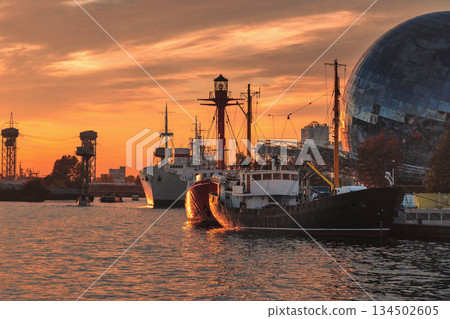 Pregolya River and ships in Kaliningrad at sunset. Russia Pregolya River and ships in Kaliningrad at sunset. Russia 134502605