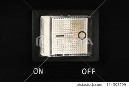 Rectangular power on-off switch close-up on black background 134502709