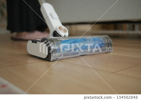 Detailed view of a vacuum cleaner in a living room 134502848
