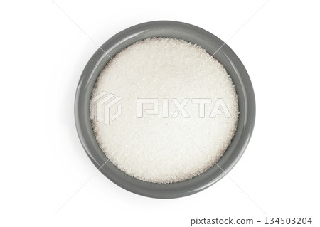 White sugar in ceramic bowl isolated on white background. Top view. Flat lay White sugar in ceramic bowl isolated on white background. Top view. Flat lay 134503204