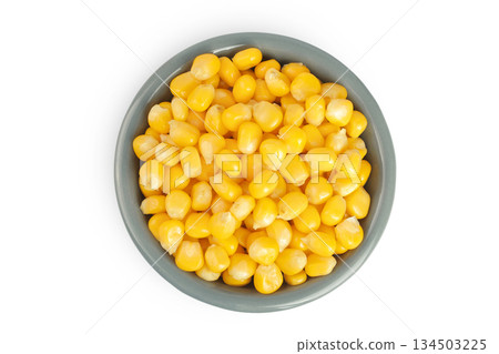 corn seeds in ceramic bowl isolated on white background. Top view. Flat lay corn seeds in ceramic bowl isolated on white background. Top view. Flat lay 134503225