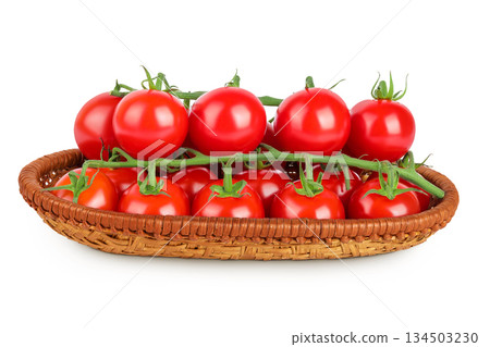 Cherry tomato bunch in a wicker basket isolated on white background 134503230