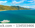 A boat on the azure sea off the coast of Nanshan Park, Sanya, Hainan Island, China 134503466