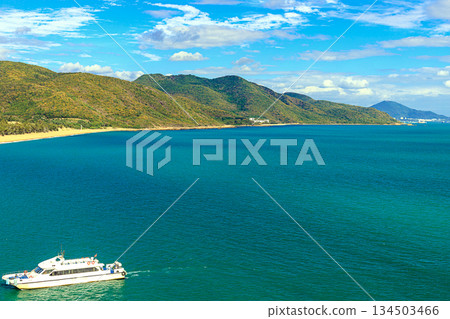 A boat on the azure sea off the coast of Nanshan Park, Sanya, Hainan Island, China A boat on the azure sea off the coast of Nanshan Park, Sanya, Hainan Island, China 134503466