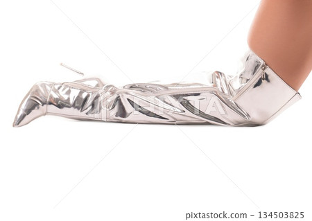Silver over the knee boots on white background showcasing fashion style 134503825