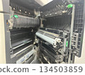 A detailed view of a printer's internal components like rollers, belts, and the toner system, perfect for technical manuals, machinery diagrams, and advanced repair service promotions. 134503859