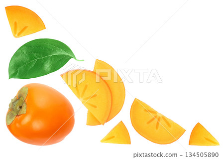 persimmon fruit slice with leaves isolated on white background. Top view. Flat lay pattern persimmon fruit slice with leaves isolated on white background. Top view. Flat lay pattern 134505890