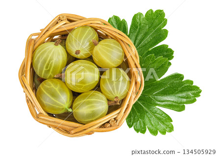 Green gooseberry in a wicker basket isolated on white background. Top view. Flat lay. 134505929