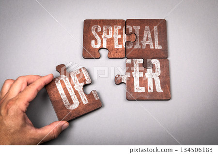 Special Offer Concept with Puzzle Pieces on Gray Background Special Offer Concept with Puzzle Pieces on Gray Background 134506183