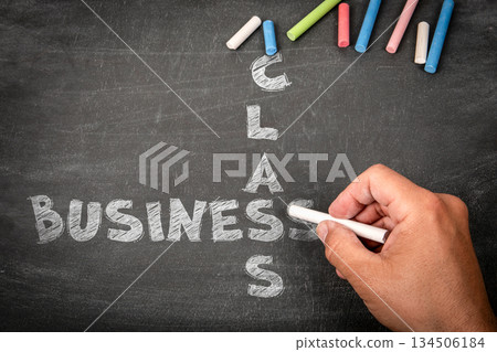 Business Class Concept Written with Chalk on Blackboard by Hand Business Class Concept Written with Chalk on Blackboard by Hand 134506184