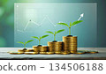 金幣和嫩葉象徵著財富的累積和投資的成長。 134506188