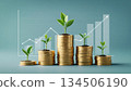 金幣和嫩葉象徵著財富的累積和投資的成長。 134506190