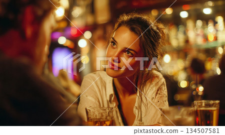 woman in a casual shirt, looking genuinely interested and engagingly at a date or friend in a cozy lit bar or pub. Captures authentic social interaction, first dates, and nightlife lifestyle moments. woman in a casual shirt, looking genuinely interested and engagingly at a date or friend in a cozy lit bar or pub. Captures authentic social interaction, first dates, and nightlife lifestyle moments. 134507581