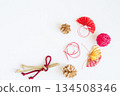 Red and gold fans, mizuhiki cords, and string New Year's decorations lined up on a white background 134508346
