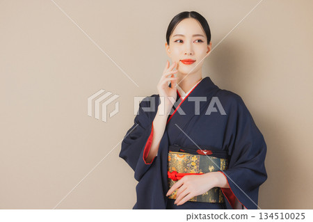 A woman in a kimono 134510025