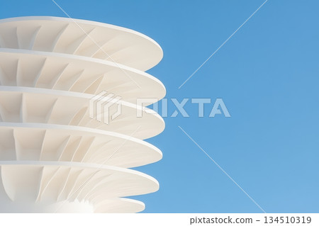 Modern architectural design showcasing sleek white curves against clear blue sky Modern architectural design showcasing sleek white curves against clear blue sky 134510319