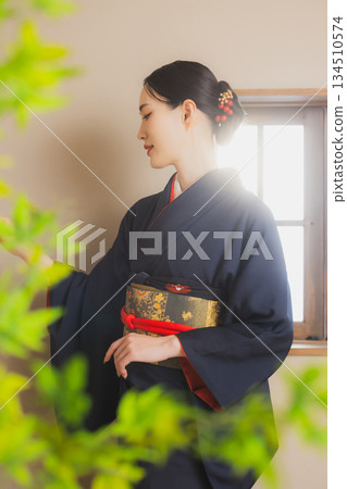 A woman in a kimono 134510574