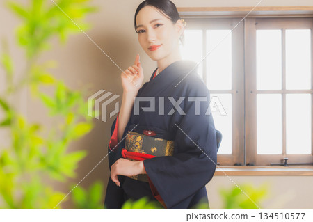 A woman in a kimono A woman in a kimono 134510577