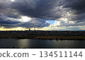A panoramic view of Tokyo's cityscape covered in thick clouds 134511144
