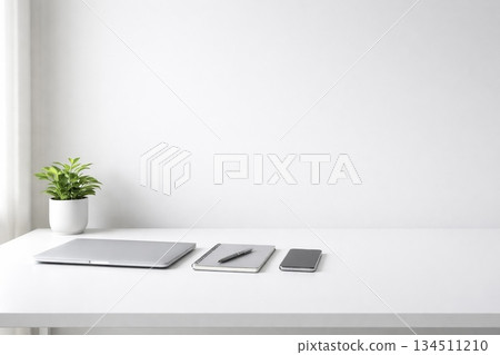 Front view of a tidy white office desk with copy space 134511210