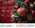 Close-up of a tree decorated with red and gold ornaments 134511404