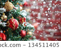 Close-up of a tree decorated with red and gold ornaments 134511405