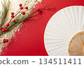 Product photography with a gold fan and branches on a red background 134511411