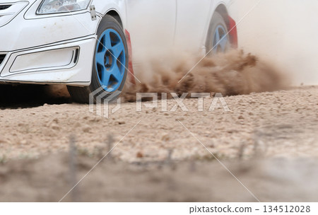 Rally racing car increase speed in dirt track 134512028