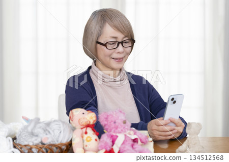 Senior woman making stuffing in the living room 134512568