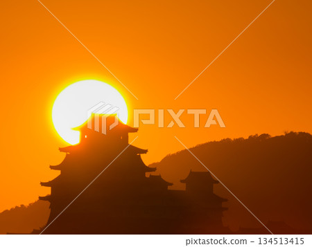 The setting sun and the silhouette of the castle The setting sun and the silhouette of the castle 134513415