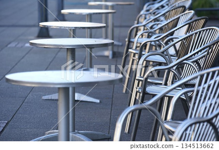 Silver table and chairs set up outdoors 134513662