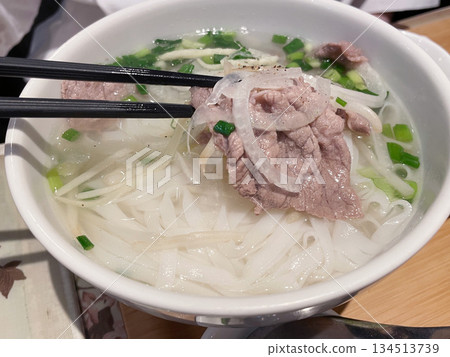 Vietnamese pho with beef: Rice noodles in a fragrant broth. Vietnamese pho with beef: Rice noodles in a fragrant broth. 134513739