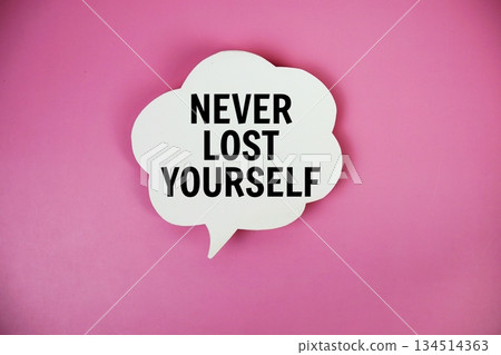 Never Lost Yourself text with speech bubble top view on pink background Never Lost Yourself text with speech bubble top view on pink background 134514363