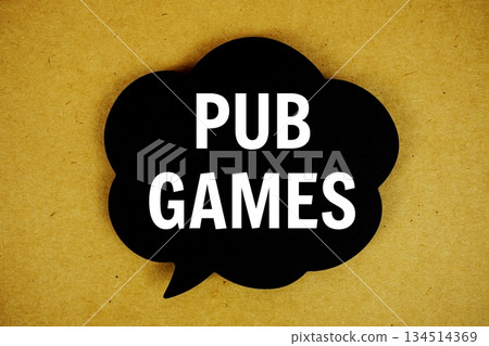 Pub Games text with speech bubble top view on yellow background Pub Games text with speech bubble top view on yellow background 134514369