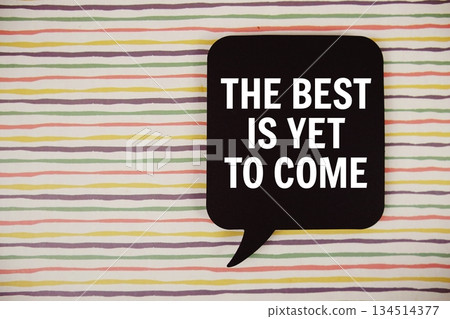 The Best Is Yet to Come text with speech bubble top view on colorful stripes background 134514377