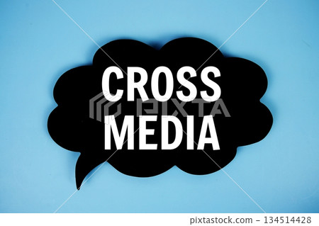 Cross Media text with speech bubble on blue background 134514428