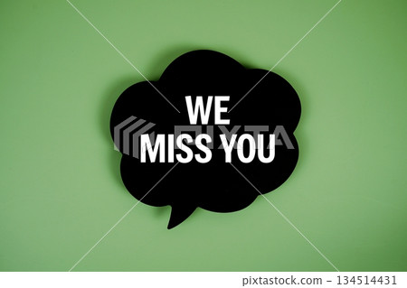 We Miss You text with speech bubble on green background 134514431