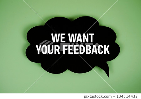 We Want Your Feedback text with speech bubble on green background 134514432