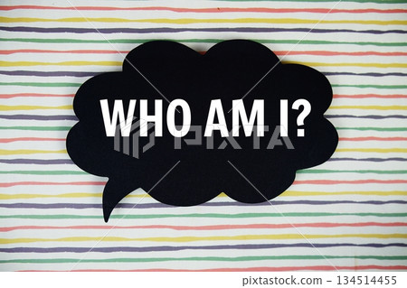 Who Am I? text with speech bubble top view on colorful stripes background 134514455