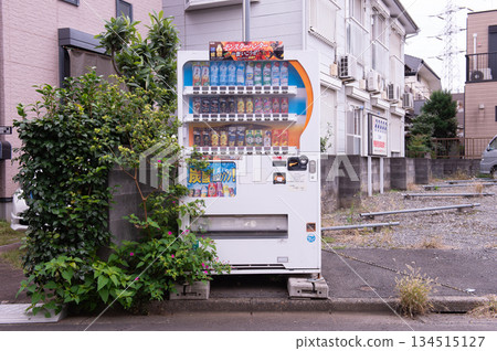 Tokyo, Japan -November 6 , 2024 : Vending machines in Tokyo, Japan. Coca-Cola vending machine on a residential street Tokyo, Japan -November 6 , 2024 : Vending machines in Tokyo, Japan. Coca-Cola vending machine on a residential street 134515127